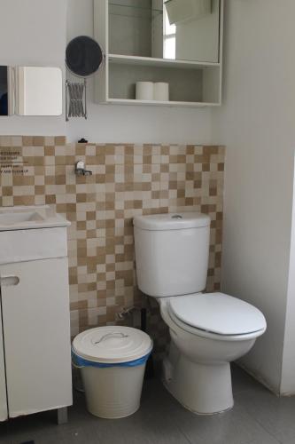 a bathroom with a toilet and a sink at Party Zone in Lisbon