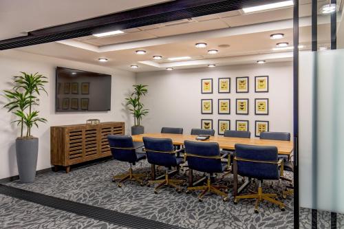 a conference room with a table and chairs at Hotel 1868 in Cambridge
