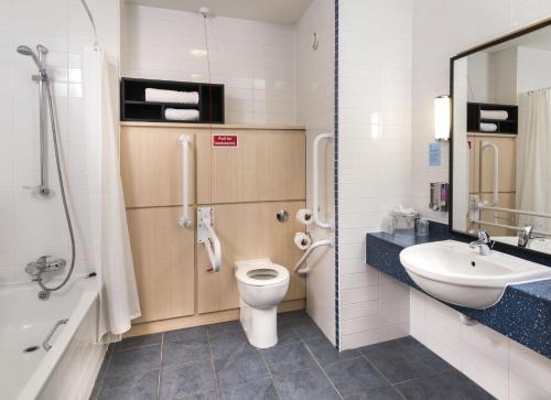 a bathroom with a toilet and a sink and a shower at Holiday Inn Express Birmingham Star City, an IHG Hotel in Birmingham