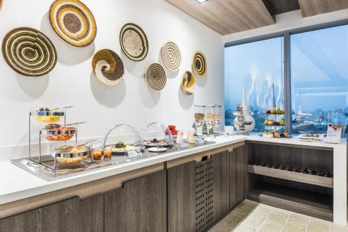 a buffet in a restaurant with a view of the city at Holiday Inn Express - Barranquilla Buenavista by IHG in Barranquilla