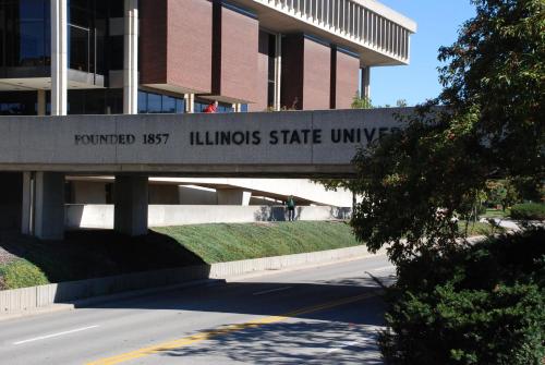 a building with a sign for the university of illinois state university at Holiday Inn Express Hotel & Suites Bloomington-Normal University Area by IHG in Bloomington