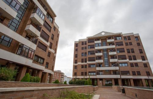 two tall buildings are next to each other at Cubell Home in Cuenca