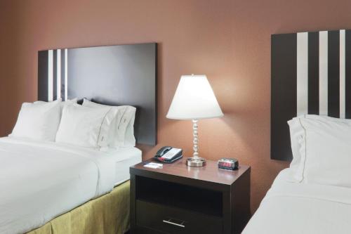 a hotel room with two beds and a table with a lamp at Holiday Inn Express Columbia by IHG in Columbia
