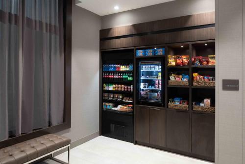 a room with a refrigerator with drinks in it at Staybridge Suites - Quincy by IHG in Quincy