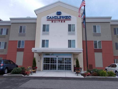 a building with a sign on the front of it at Candlewood Suites Burlington by IHG in Burlington