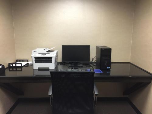 an office with a desk with a computer and a printer at Holiday Inn Express and Suites - Bradford by IHG in Bradford