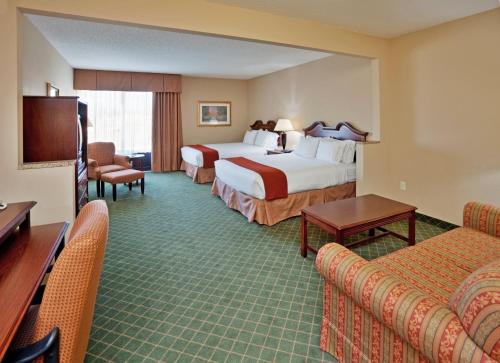 a hotel room with two beds and a television at Holiday Inn Express Hotel & Suites Cape Girardeau I-55, an IHG Hotel in Cape Girardeau