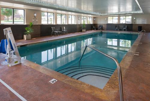a large swimming pool in a building at Holiday Inn Express & Suites Nashville Southeast - Antioch, an IHG Hotel in Antioch
