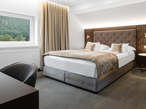 Postel nebo postele na pokoji v ubytování Garni Hotel Cirman