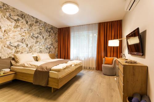 A bed or beds in a room at SCA Sofia City Apartments