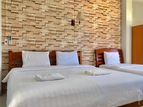 מיטה או מיטות בחדר ב-Pantip Residence