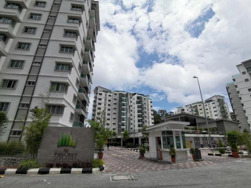 a tall white building in a city with buildings at The Quintet, Tower Ethel in Tanah Rata