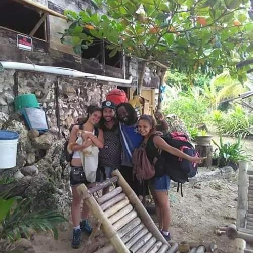 a group of people posing for a picture at Port Antonio Brian's Beach House in Port Antonio