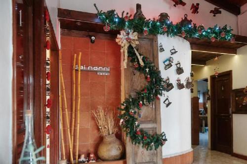 a store front with christmas decorations on the wall at Dai Nonni Hotel in Guatemala