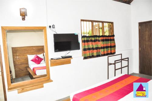 TV a/nebo společenská místnost v ubytování Surathura homestay