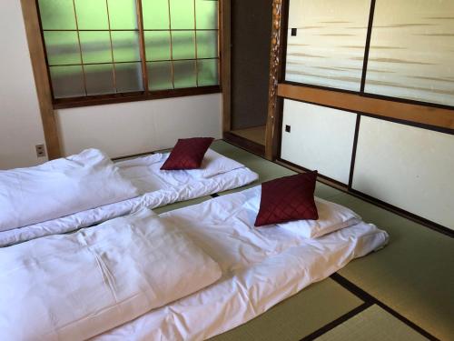 Katil atau katil-katil dalam bilik di Cool-Cottage Otaru OTAMOI