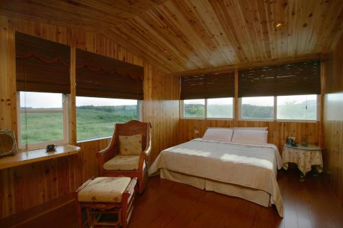 Postel nebo postele na pokoji v ubytování Penghu Kite House