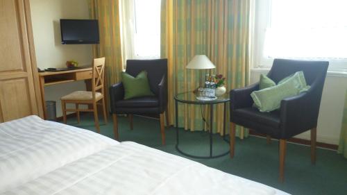 Ένα ή περισσότερα κρεβάτια σε δωμάτιο στο Hotel Landhaus Apartments
