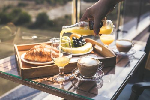 a tray of food and drinks on a table at Plaza Hotel Plovdiv - Free Parking in Plovdiv