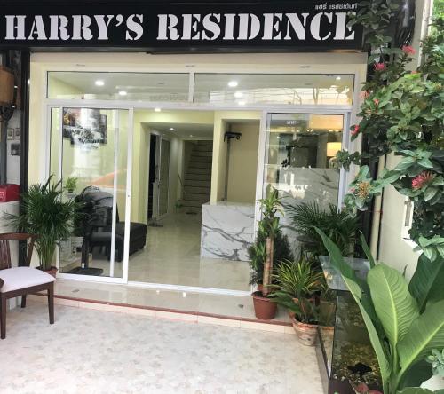 a store front with a sign that reads harleys relocated at HARRYS RESIENDENCE in Bangkok