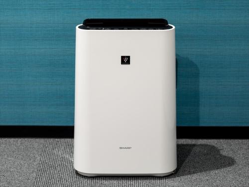 a cell phone sitting on top of a white refrigerator at Green Rich Hotel Tottori Ekimae (Artificial hot spring Futamata Yunohana) in Tottori