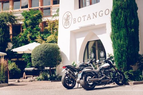 a motorcycle parked in front of a building at Botango in Parcines