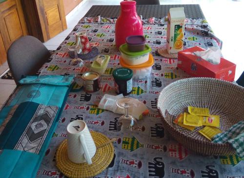 a table with a table cloth with toys on it at Chez Coumba et Daniel in Saly Portudal