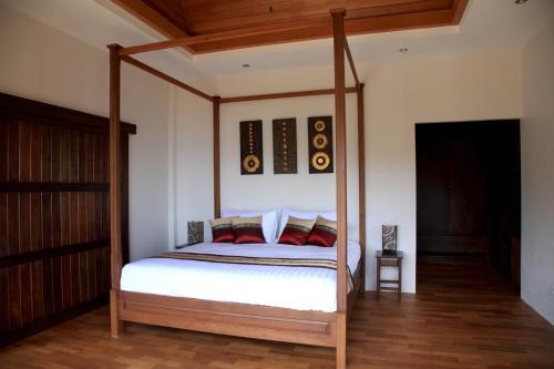 Ένα ή περισσότερα κρεβάτια σε δωμάτιο στο Koh Phangan Pavilions Serviced Apartments