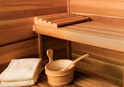 a sauna with a bowl of water and a spoon at Al Jazeera Hotel Apartments LLC in Dubai