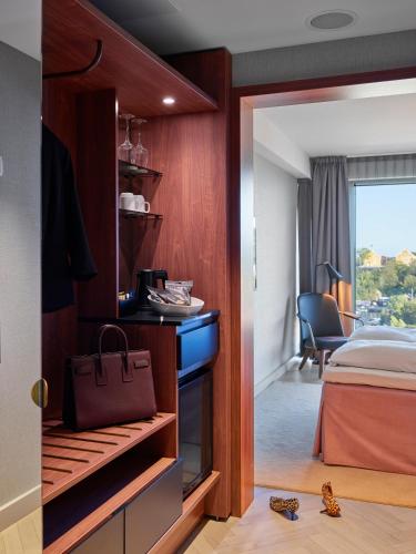 Ένα ή περισσότερα κρεβάτια σε δωμάτιο στο Radisson Blu Caledonien Hotel, Kristiansand
