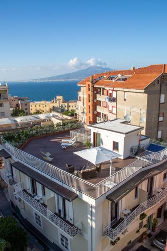 a view of a building with a parking lot at Il Melograno Relais in Vico Equense
