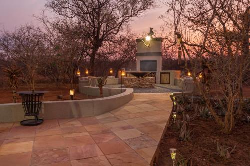 a stone patio with a building in the background at Ukuthula Bush Lodge in Hoedspruit