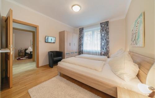 a bedroom with a large bed and a window at Ferienhaus Mit Panoramablick in Eisenberg an der Pinka