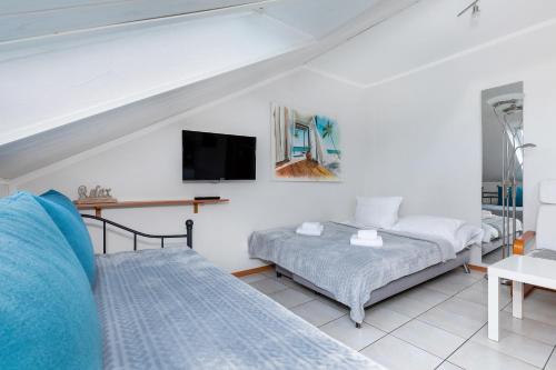 Posteľ alebo postele v izbe v ubytovaní Apartamenty Pod Wieżyczkami by Noclegi Renters