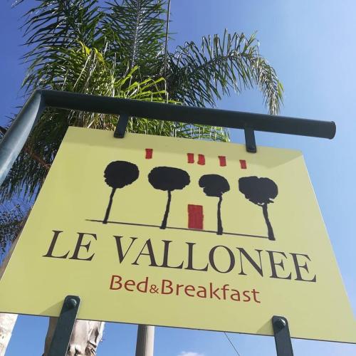 Un certificado, premio, letrero u otro documento en Le Vallonee B&B