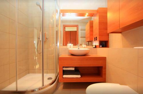 a bathroom with a sink and a shower at Luxury space at the best address in Bratislava in Bratislava