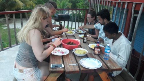 a group of people sitting at a table eating food at Sugar Patch Inn in Hopkins