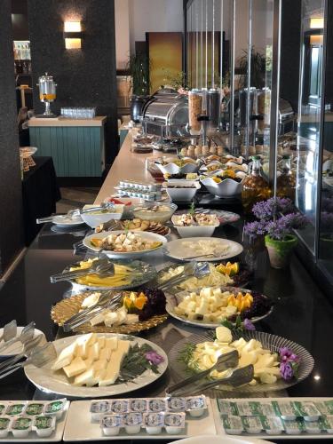 a buffet with many plates of food on a table at Heybeli Hotel in Mudanya