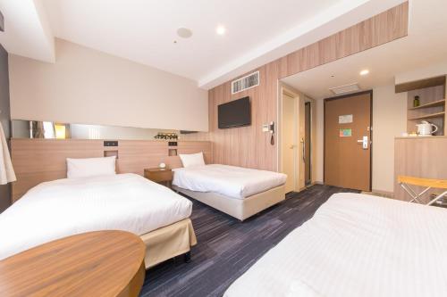 Postel nebo postele na pokoji v ubytování Hotel IL Cuore Namba