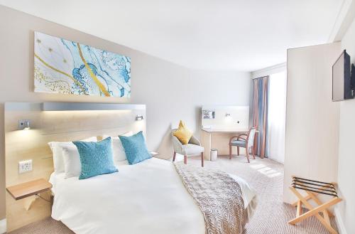 Кровать или кровати в номере RH Hotel Pretoria