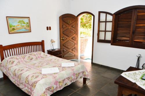 Tempat tidur dalam kamar di Hotel Fazenda Villa Galicia