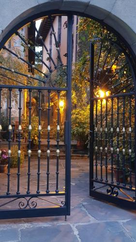 an iron gate in front of a building at Apartamentos Villa de Potes in Potes