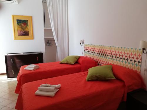 Posteľ alebo postele v izbe v ubytovaní Appartamento Silvana