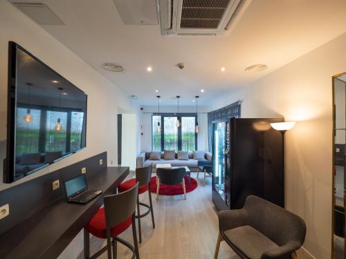 a living room with a table and chairs at Hotel Best Western City Centre in Brussels
