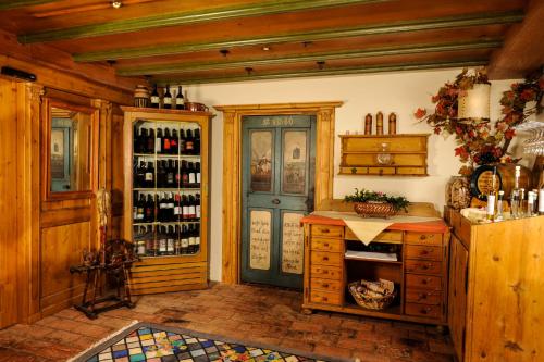 a wine tasting room with a blue door at Hotel & Restaurant Wastlwirt in Sankt Michael im Lungau
