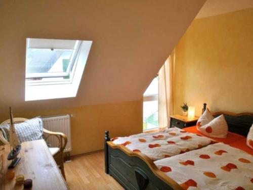 a bedroom with a bed and a skylight at Ferienwohnung Heiden _ 100m bis zu in Ostseebad Karlshagen
