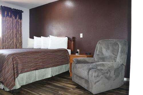 Postel nebo postele na pokoji v ubytování Western motel