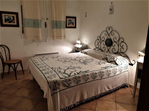 A bed or beds in a room at Casa Maria