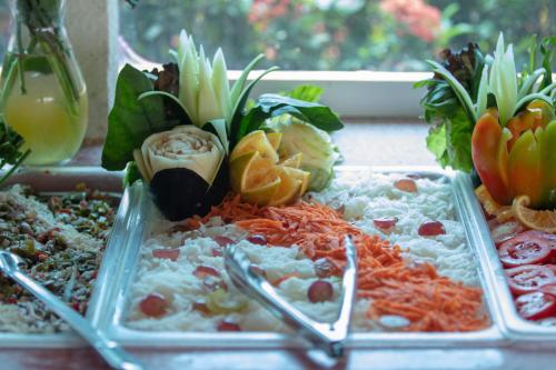 a display of different types of food on a table at Qualton Club Ixtapa All Inclusive in Ixtapa