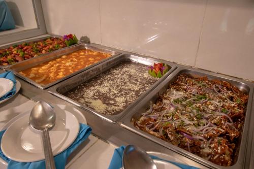 two trays of food sitting on a table at Qualton Club Ixtapa All Inclusive in Ixtapa